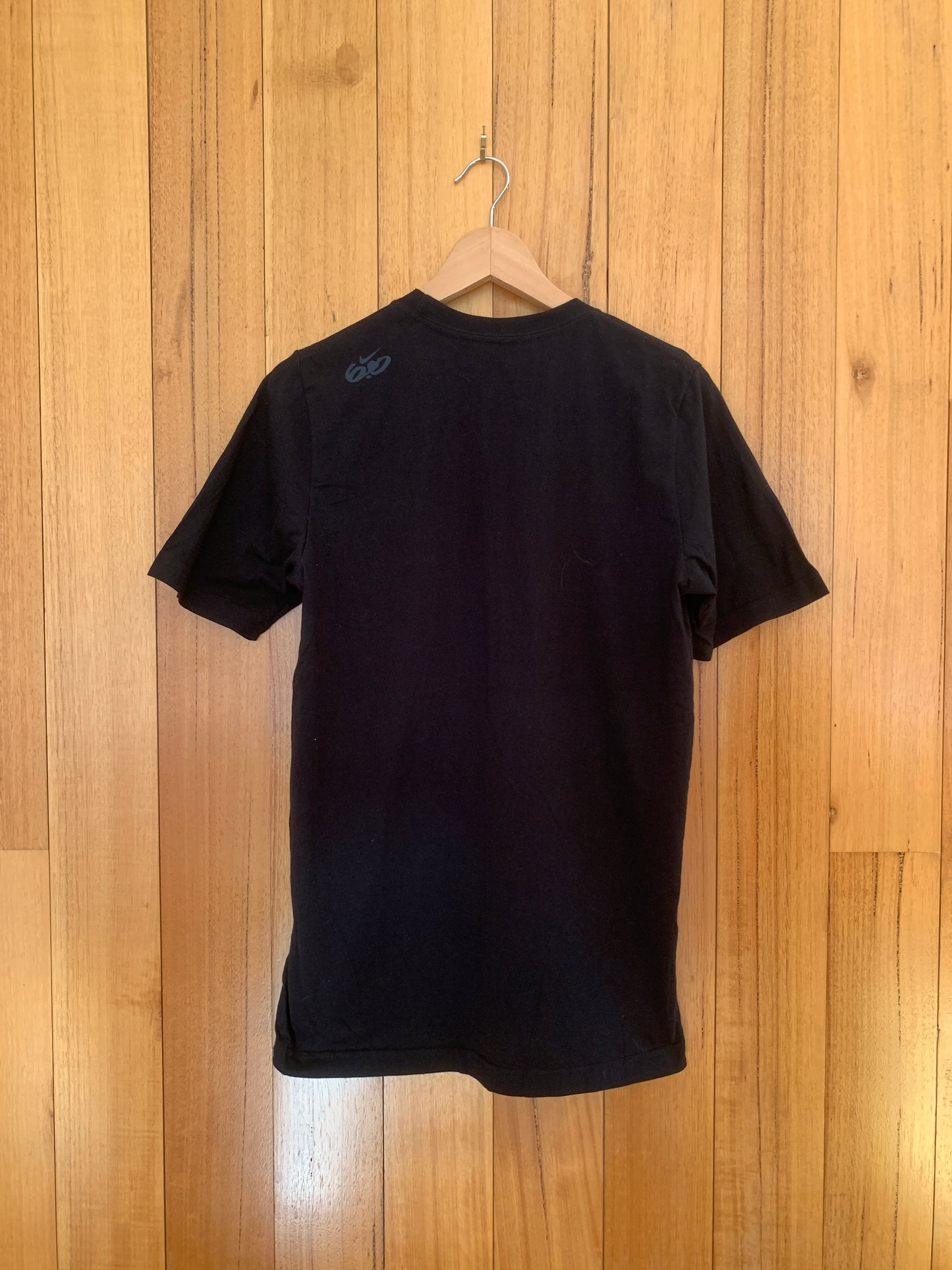 Nike 6.0 Ride with Friends T-Shirt in black showing back design with action sports graphics