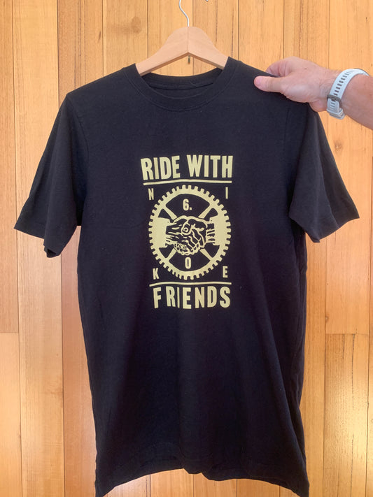 Close-up of 'Ride with Friends' graphic on black Nike 6.0 t-shirt