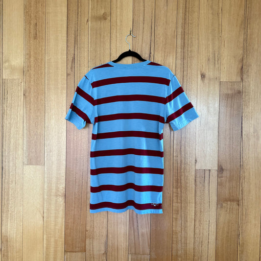 Nike Action Sports Striped Pocket T-Shirt in light blue showing back design