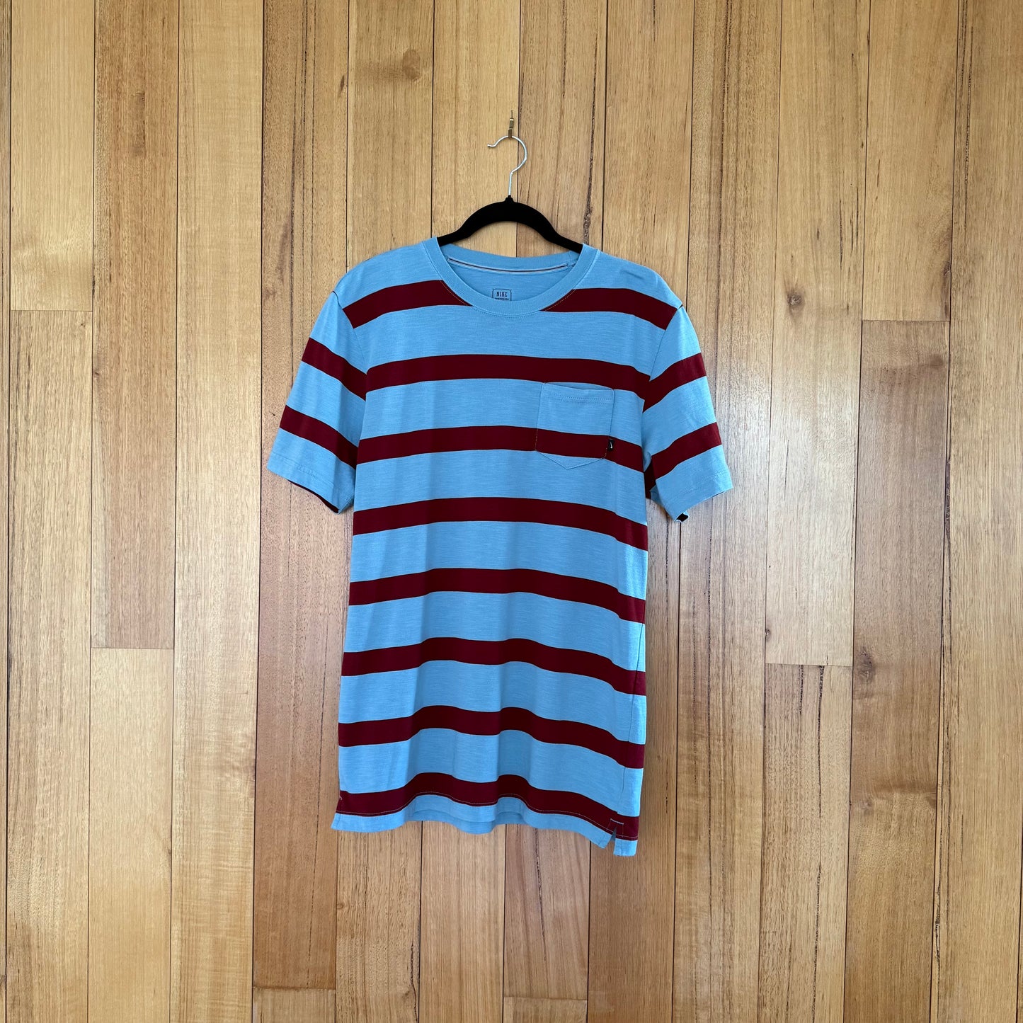 Nike Action Sports Striped Pocket T-Shirt in light blue with maroon stripes - front view