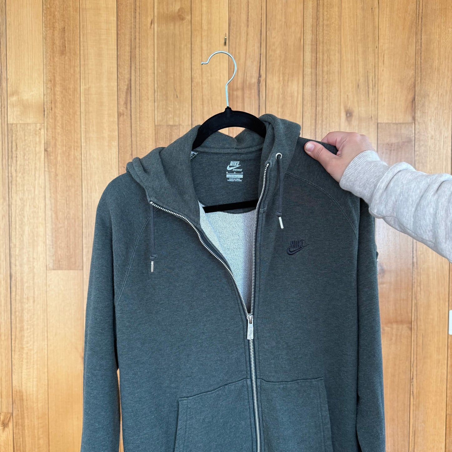Nike Swoosh logo detail on green organic cotton full zip hoodie
