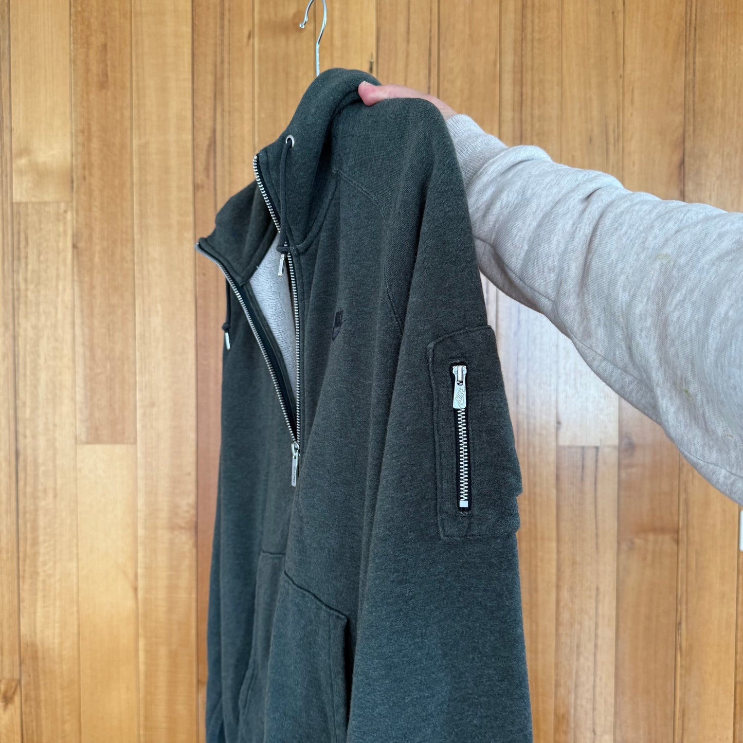 Close-up of pocket detailon green Nike Sportswear hoodie