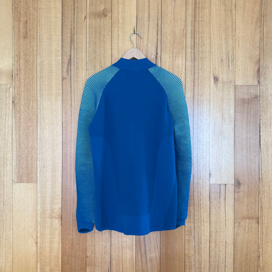 Nike Tech Knit Dynamic Reveal Jacket in turquoise showing back design with volt details