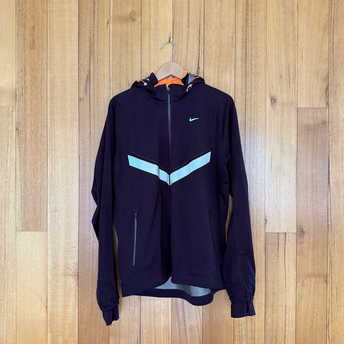 Nike Vapor Storm-Fit Running Jacket in maroon with reflective details - front view
