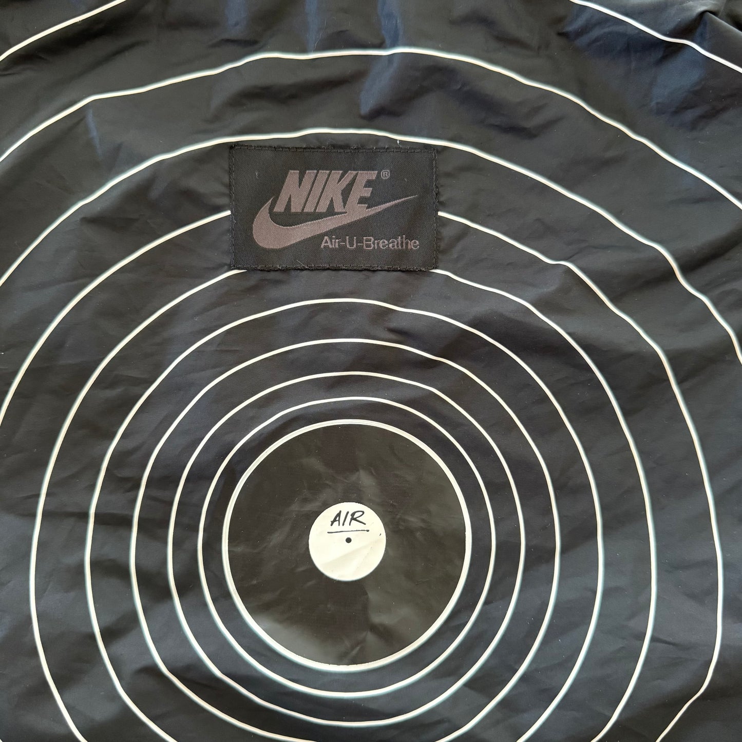 Nike Sportswear x Ben Drury Hold Tight Windrunner Jacket with carry bag