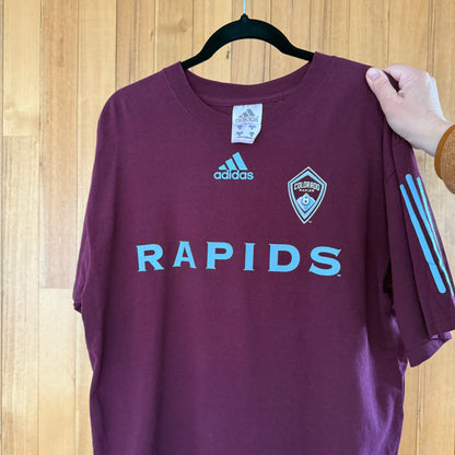 Close-up detail of blue print on Colorado Rapids purple Adidas soccer t-shirt in worn condition
