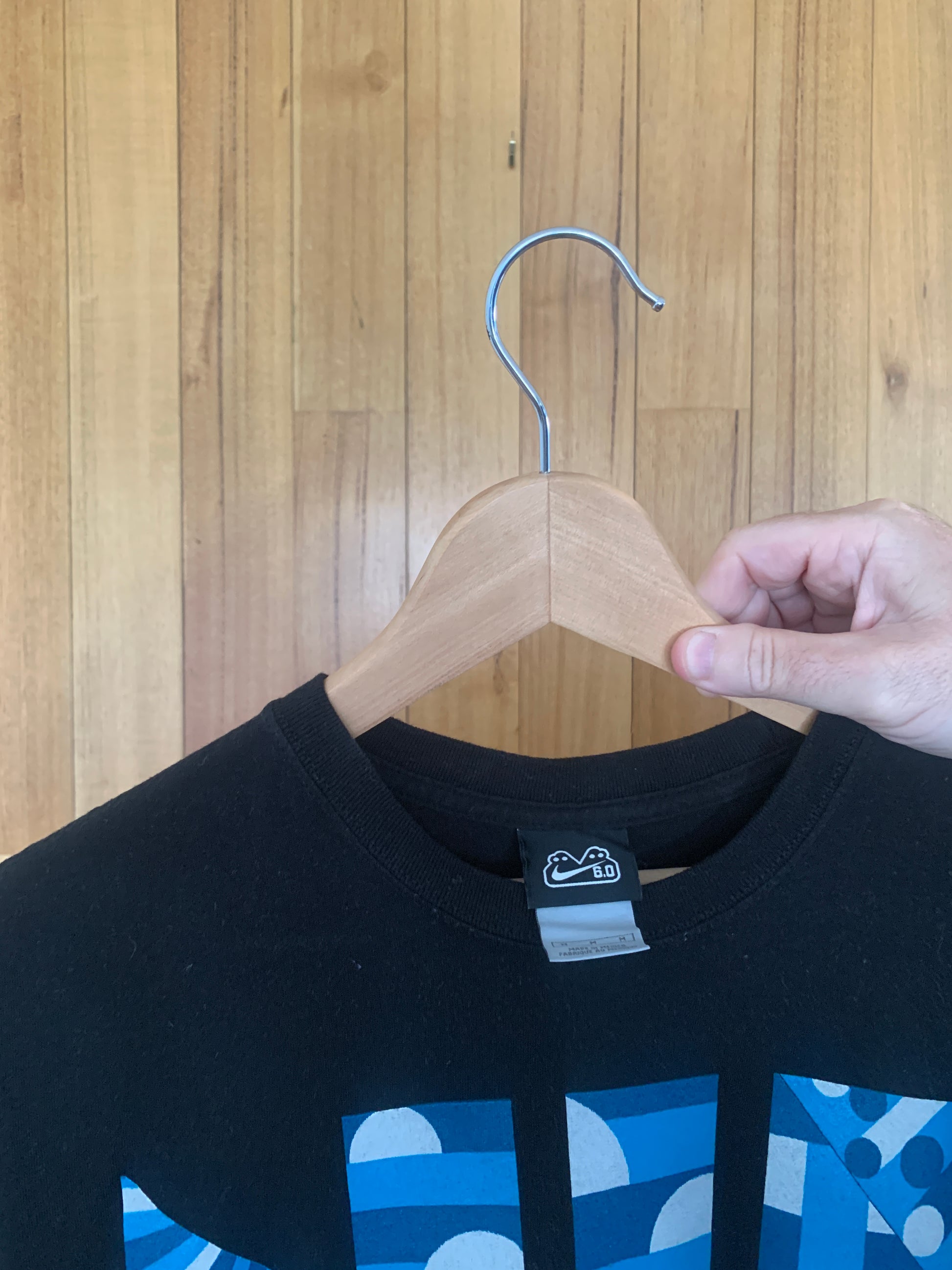 Close-up of iconic two-headed monster logo on vintage Nike 6.0 t-shirt