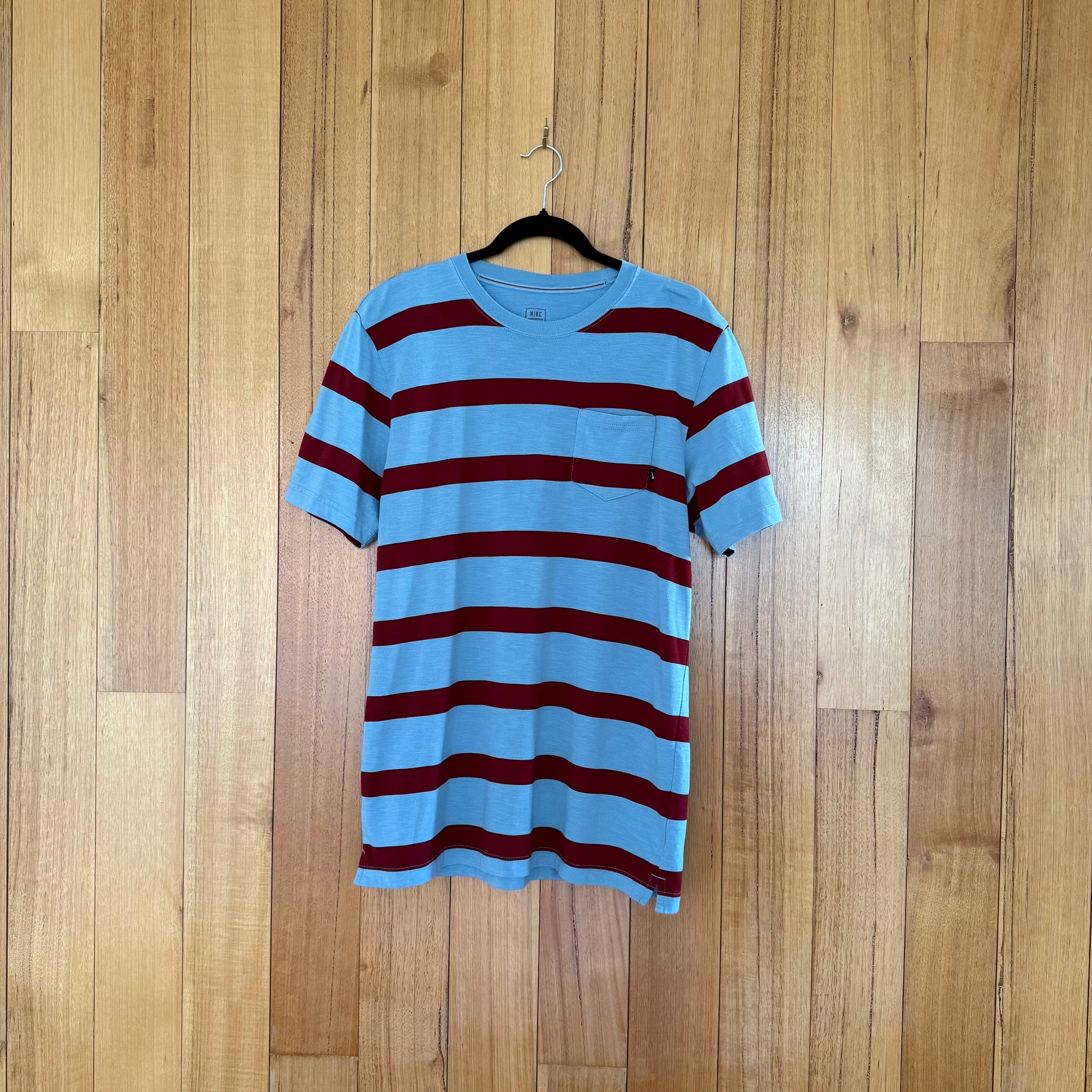 Nike Action Sports Striped Pocket T-Shirt in light blue with maroon stripes - front view
