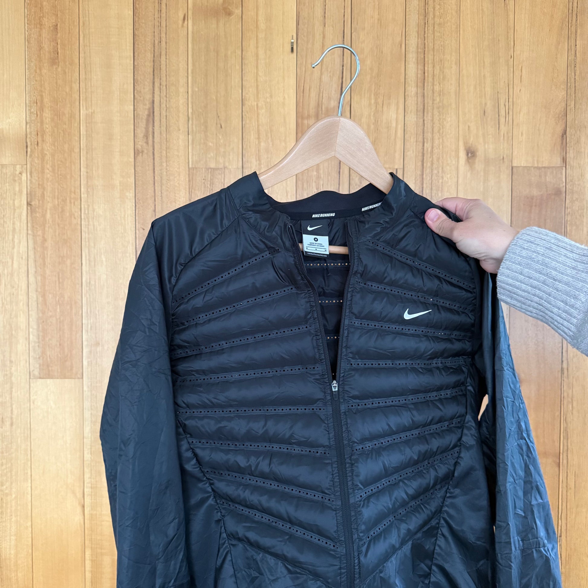 Label detail on black Nike Aeroloft 800 down running jacket