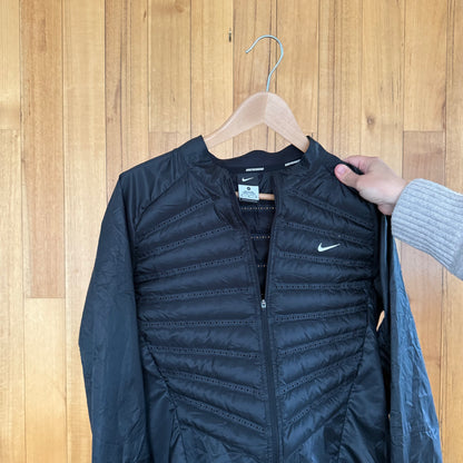 Label detail on black Nike Aeroloft 800 down running jacket