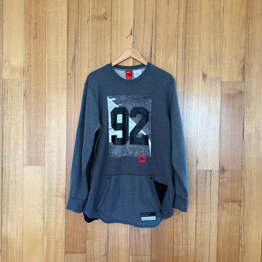 Nike Air 92 Crew Sweatshirt in grey with black, grey, white and red print - front view of Holiday 2016 sweatshirt 802640-071