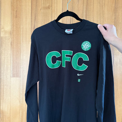 Close-up of Celtic Football Club logo on black Nike long-sleeve t-shirt