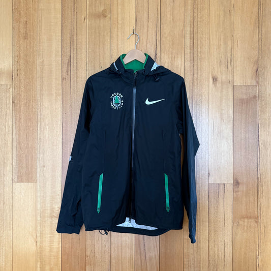 Nike Oregon Track Club Waterproof Jacket in black with green, silver and white accents - front view