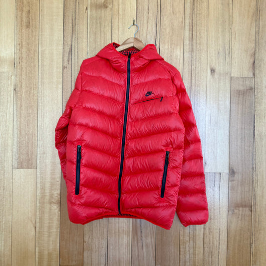 Nike Sportswear goose down puffer jacket in red with black print detail, premium down insulation, Fall 2010 release, pre-owned condition