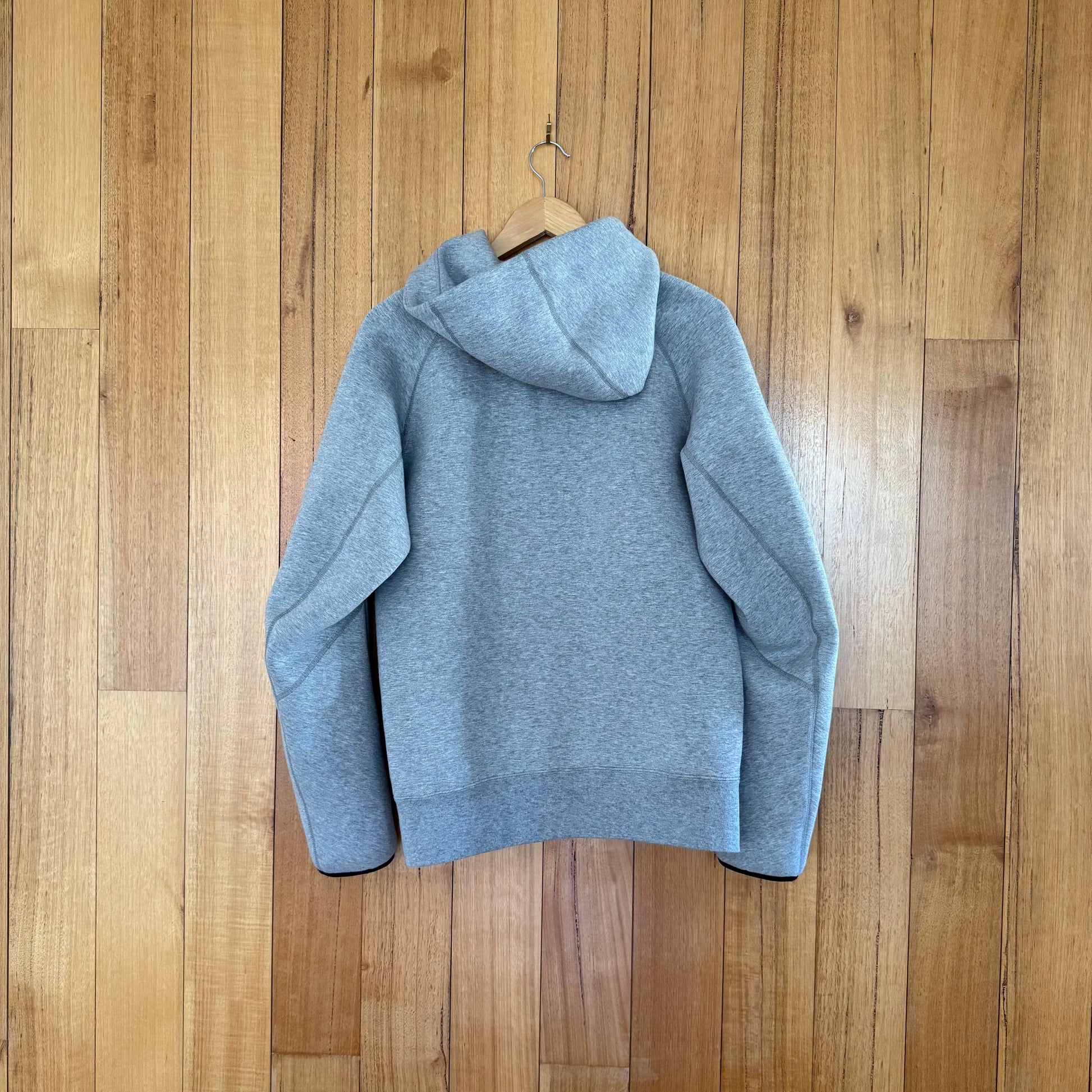 Nike Sportswear Tech Fleece hoodie back view showing grey colorway and premium fleece construction from Fall 2013