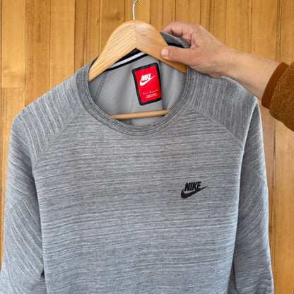 Close-up detail of label on Nike Tech Fleece grey crew sweatshirt