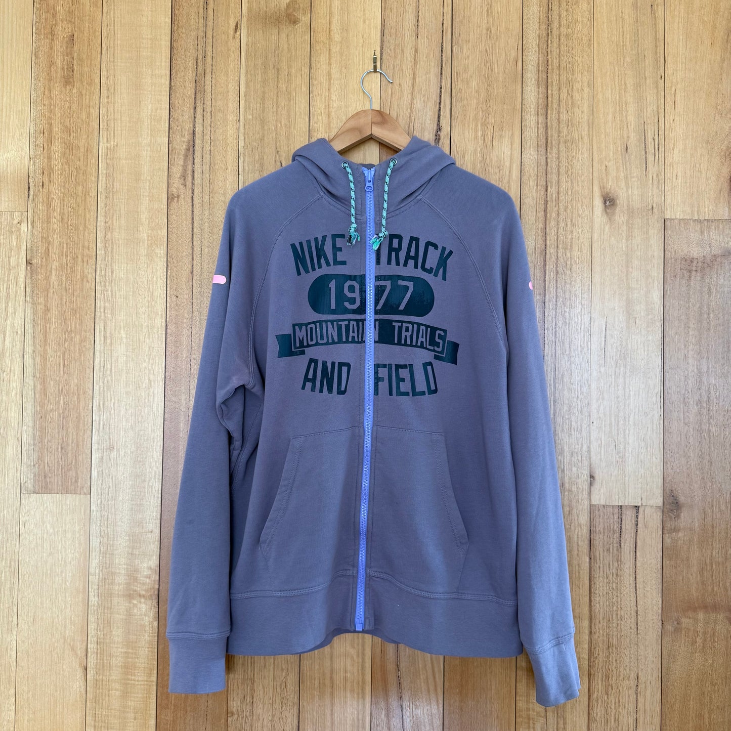 Nike Track & Field 1977 Mountain Trials full-zip hoodie in purple with black retro graphic, Holiday 2012 release, pre-owned condition