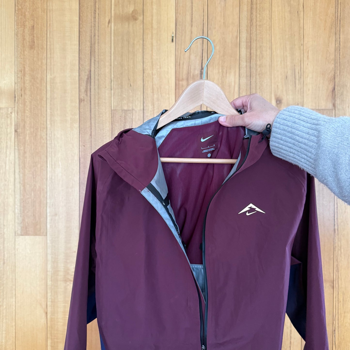 Label detail on maroon and navy Nike Cosmic Peaks Gore-Tex jacket