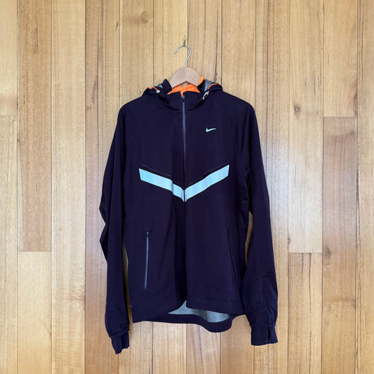 Nike Vapor Storm-Fit Running Jacket in maroon with reflective details - front view